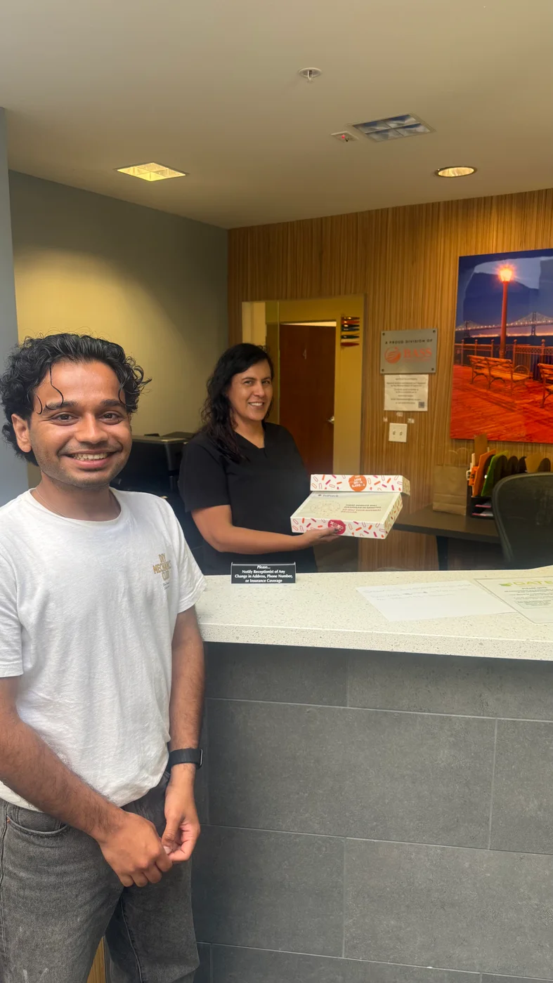 Dhruv meeting a team member at a healthcare practice’s reception